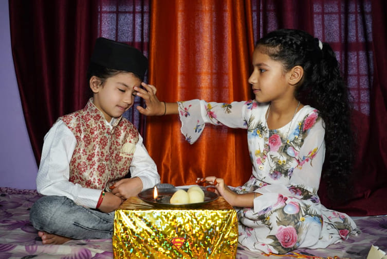 Sisters applied tilak on their foreheads and wished their brother a long life.