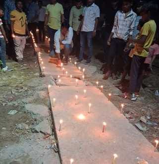 Diwali celebrated by lighting candles on the roadside for repairs