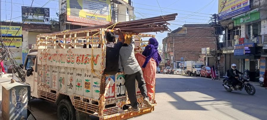 Workers bypass rules, travel in cargo vehicles, fearing accidents