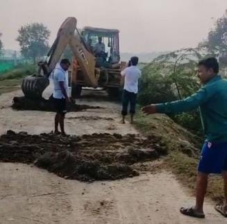Social worker got the potholes filled by putting soil on the road