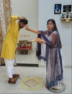 Sisters applied Tilak and prayed for the long life of their brother.