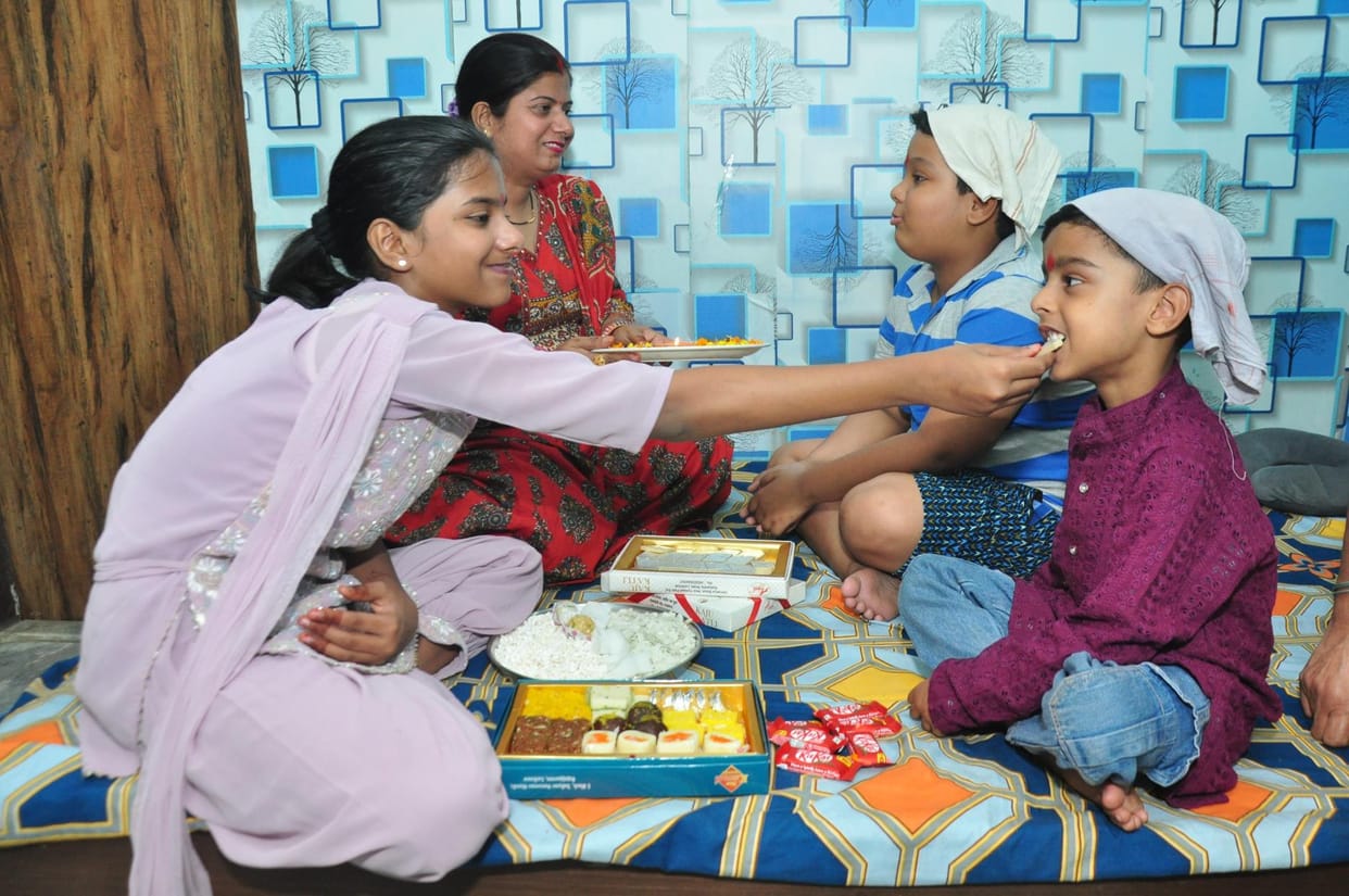 Wishing long life to brothers by applying affectionate vaccine