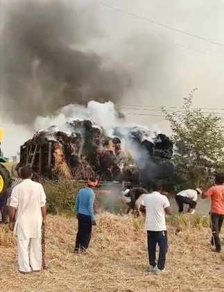A trolley full of stubble caught fire due to loose wires, and villagers brought it under control.