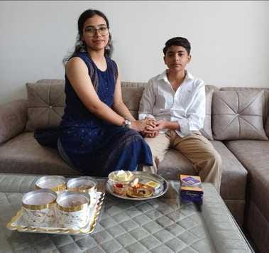 Sisters applied auspicious tilak on the forehead of their brothers and wished them happiness and prosperity.