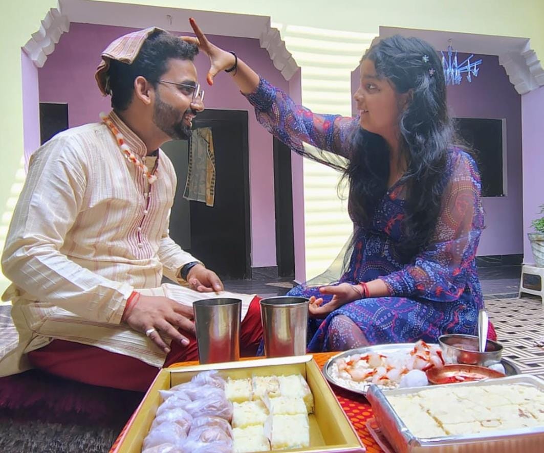 Applying tilak to brother and wishing him long life
