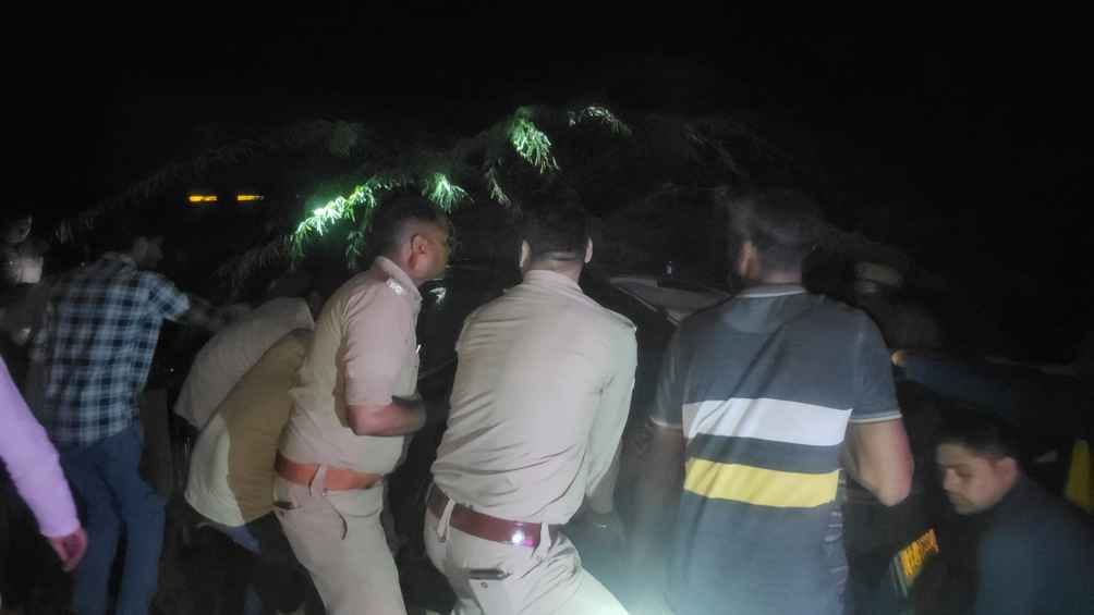 A young man trapped in a car battled death for an hour and died.