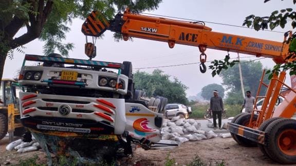 Cement-laden trailer overturns, driver trapped in cabin dies