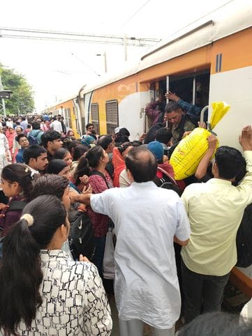 Crowds thronged trains, pushing and shoving to get on and off coaches.