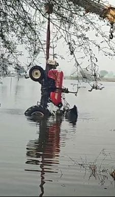 Tractor falls into pond due to waterlogging, driver saves his life by jumping