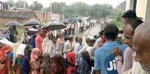 Hundreds of farmers stood in line for hours in the rain for fertilizer.