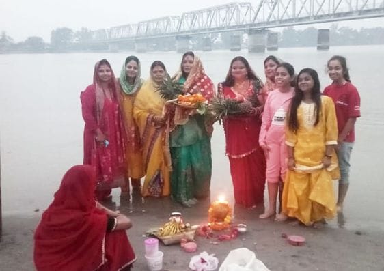 Women worshipped Chhathi Maiya by offering prayers to the setting sun.
