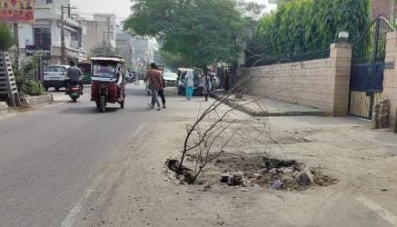 Officials forgot to repair the leak and rebuild the road, and when the road caved in, people planted bushes.
