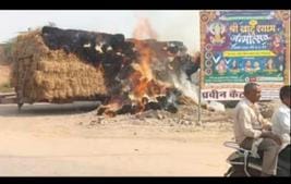 Bales of straw kept in a trolley caught fire after touching electric wires.