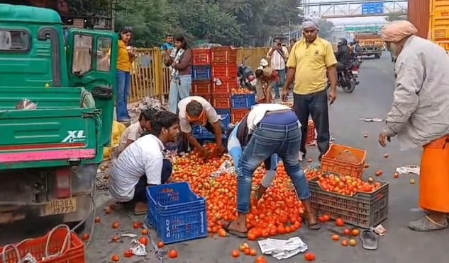 A tempo loaded with tomatoes overturned on the national highway.