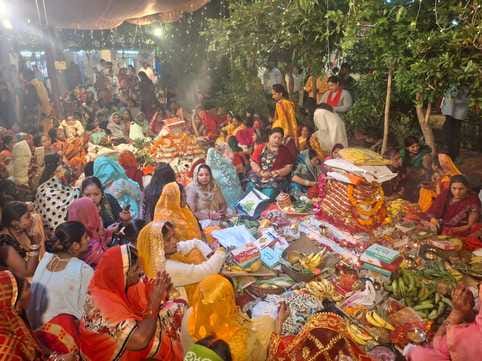 Wishing for happiness and prosperity by offering prayers to the rising sun
