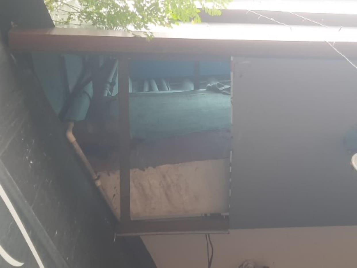 A young woman fell from the first floor of a hotel during a police raid.