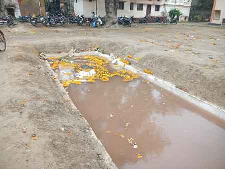 Two days after Chhath Puja, heaps of flowers, garlands and coconuts remain on the ghats.