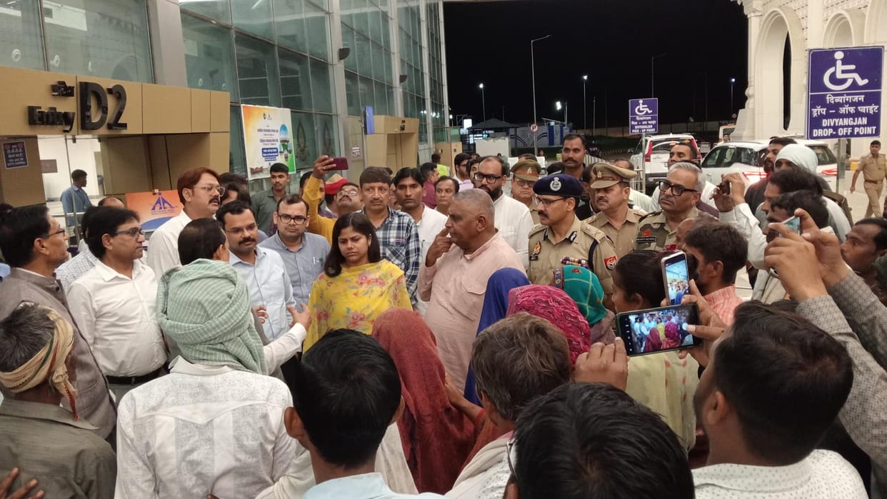 Farmers protested during the meeting at the airport.