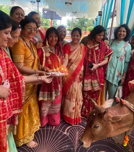 Worship of Amla trees by serving cows