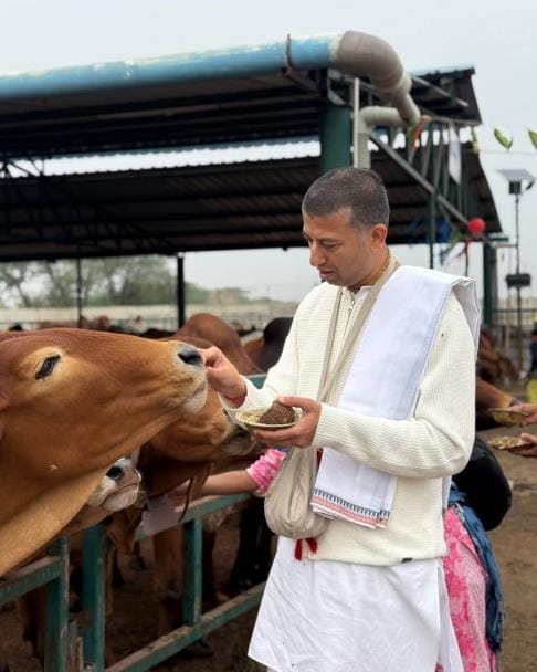 Worshiping the cow, he sought blessings for peace and happiness.