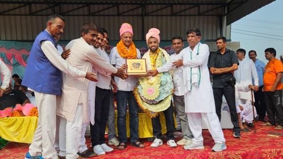By winning the gold medal at the World Wrestling Championship, wrestler Sujit elevated honor; the MLA, SP, and khap representatives honored him.