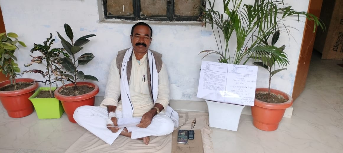 Former headman sitting on dharna in front of Pauli Block