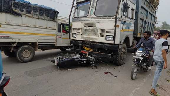 Uncontrolled bike collides with high speed truck, driver injured