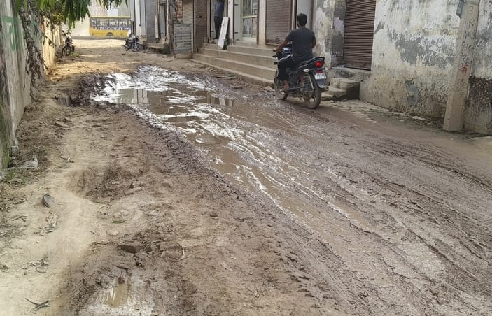 Mud filled in the lane leading to Mandwal Road