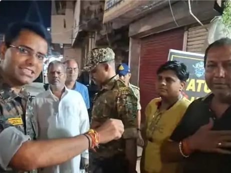 SP, former MLA face off in BalaghatUmashankar Munjare was riding a bike without helmet.