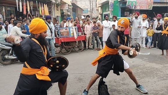 Flowers were showered on the Nagar Kirtan, Gatka group displayed their skills.