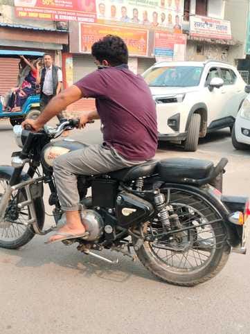 Forget wearing helmets, people are even talking on mobile phones while riding bikes.