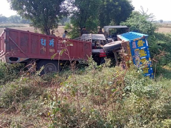 A tractor-trailer overtaking a car hit a ditch.