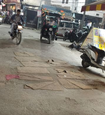 Road repairs in the city were marred by fraud, with sacks being used as patching material.