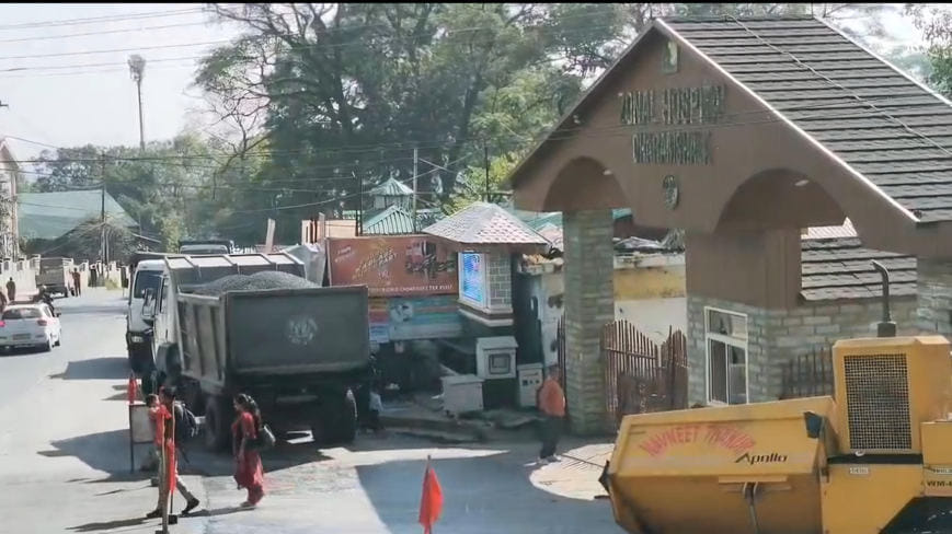 The paver finisher machine at the main gate of Dharamshala Hospital broke down.
