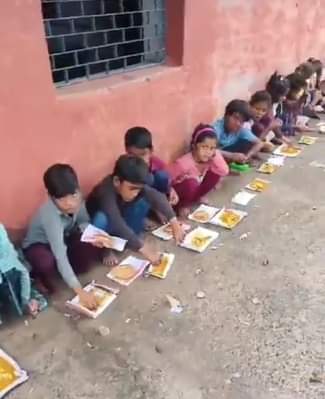 In a government school, children were given food on waste paper; the school in-charge was suspended.