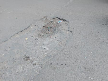 Deep potholes pose a threat on Gohana Road