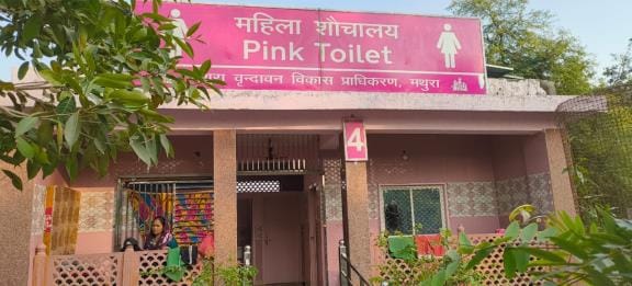 Cots were laid outside the pink toilet.