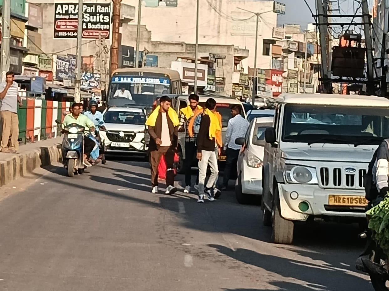 Vehicles are parked outside the yellow line on the bus stand road, causing frequent traffic jams and troubling drivers.