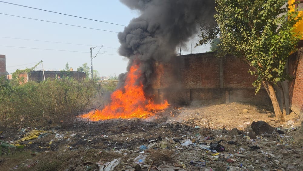 Fire broke out on a plot along the railway track... flames reached 12 feet high, and a plume of smoke rose