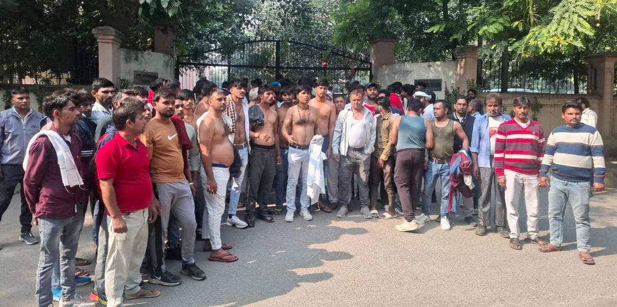 Contract workers staged a semi-naked protest after their contract expired.