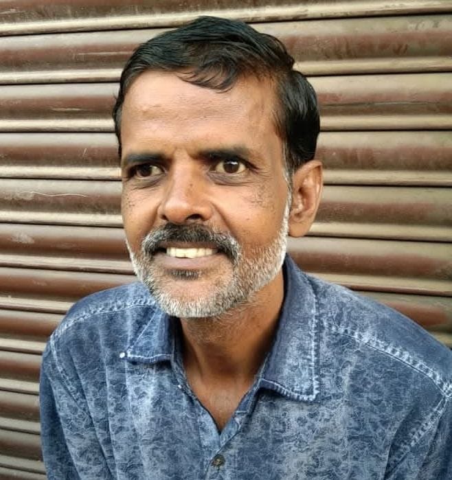 A businessman riding a bike died after being crushed by a truck loaded with sugarcane; angry family members blocked the road.