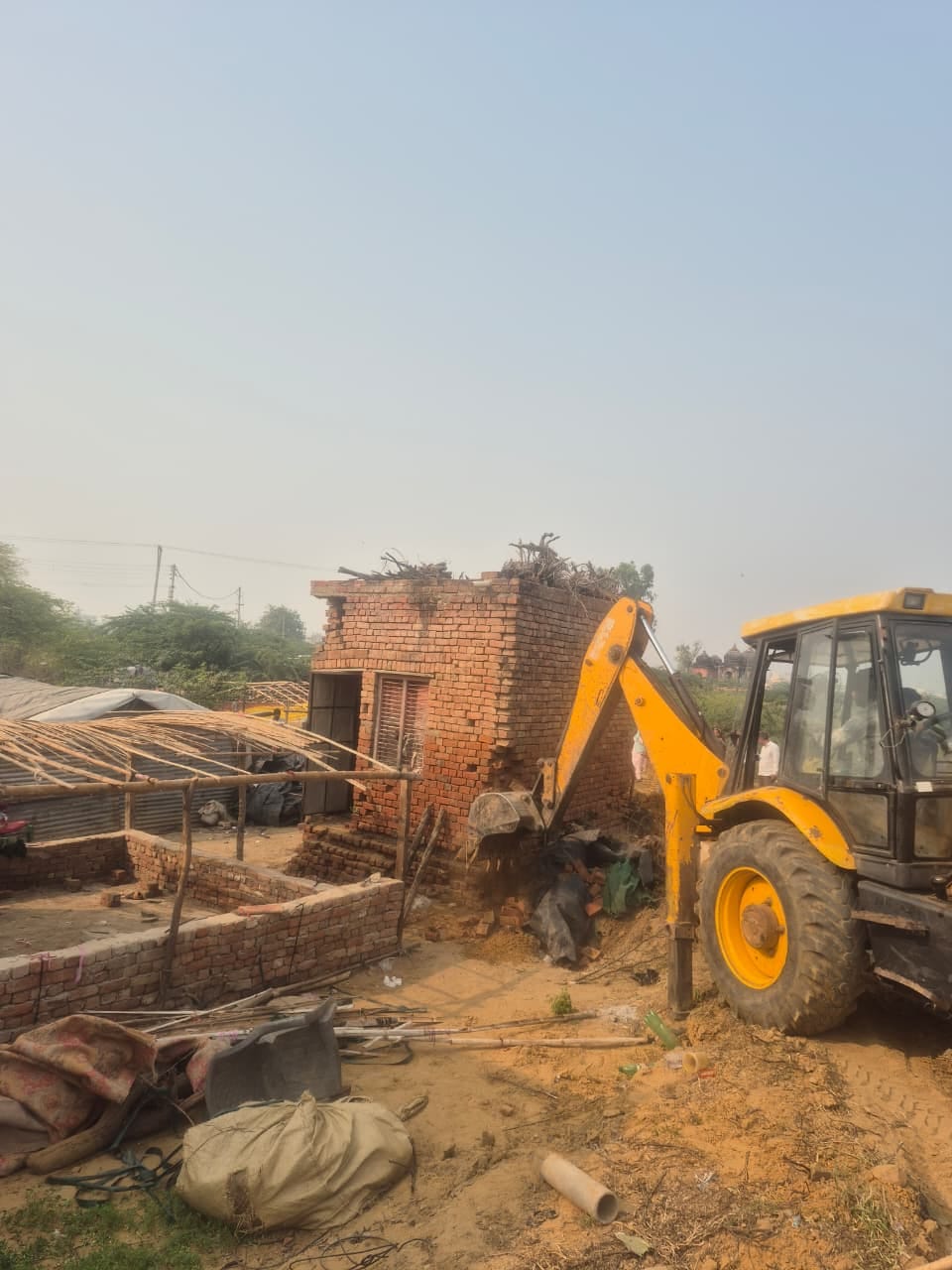 4-5 huts and one permanent structure were removed from the land of HSVP Sector 8.