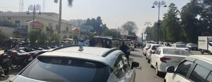 Parking is just two steps away, yet vehicles occupy the road