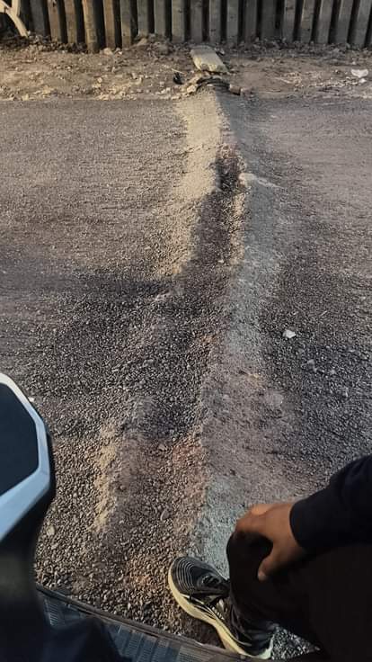 The Kanheli Road, being built at a cost of 96.60 lakh rupees, is not complete, and the stones are crumbling.