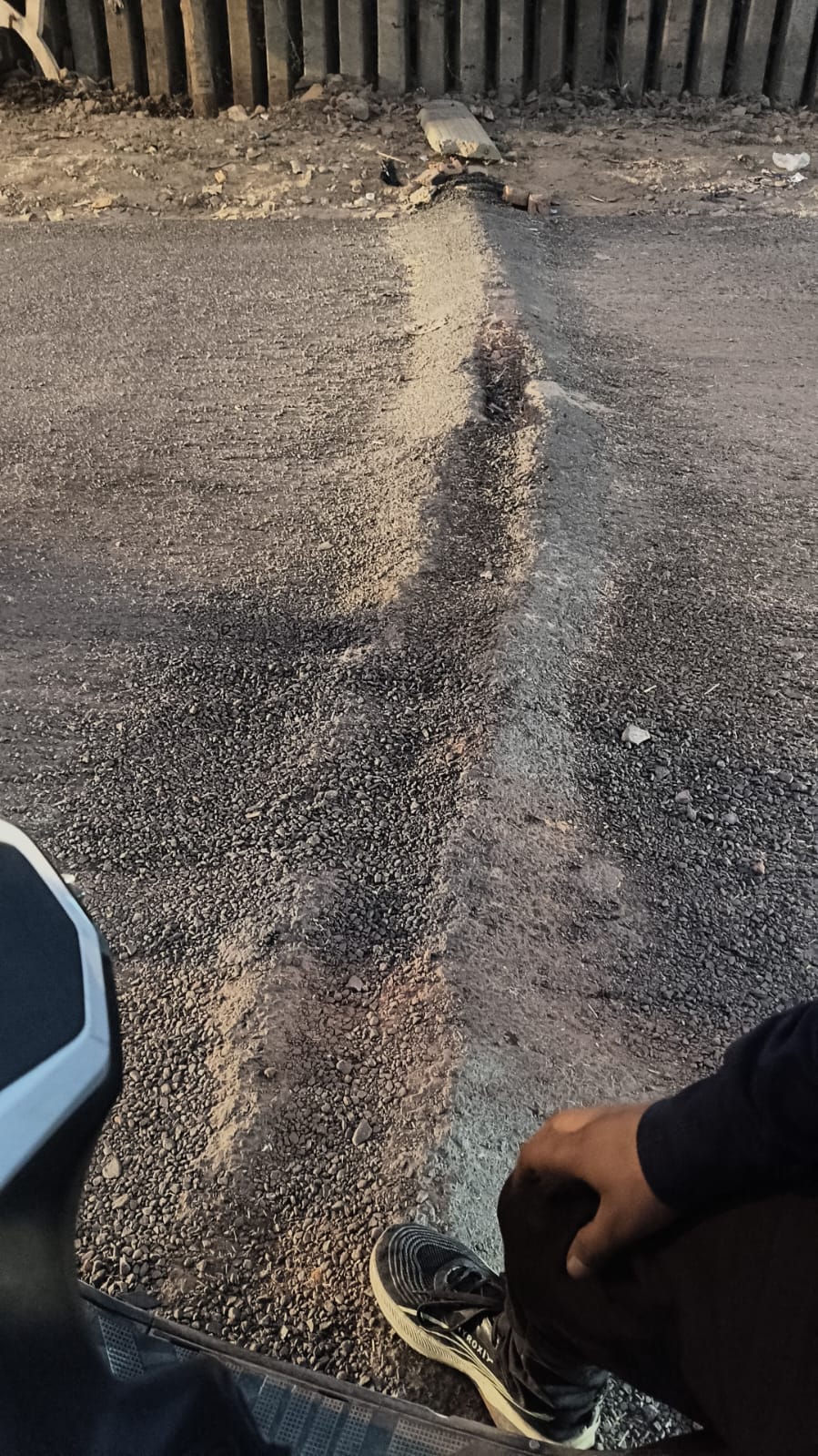 The Kanheli Road, being built at a cost of 96.60 lakh rupees, is not complete, and the stones are crumbling.