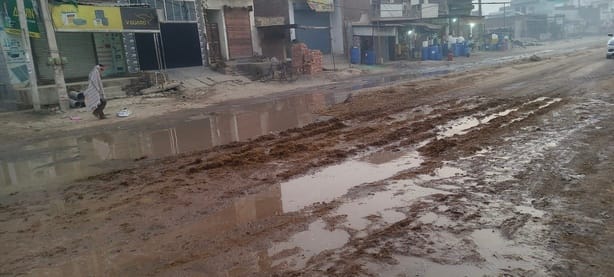 The main road of Rajound was filled with muddy water.