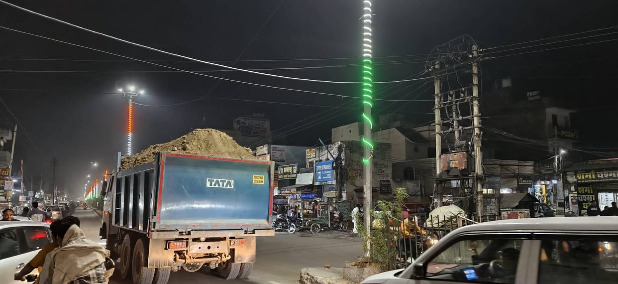 The market is buried under a blanket of dust from sand-laden trucks, traders said - it's becoming difficult to breathe, business has come to a standstill.