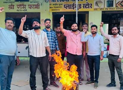Young businessmen burnt an effigy of terrorism.