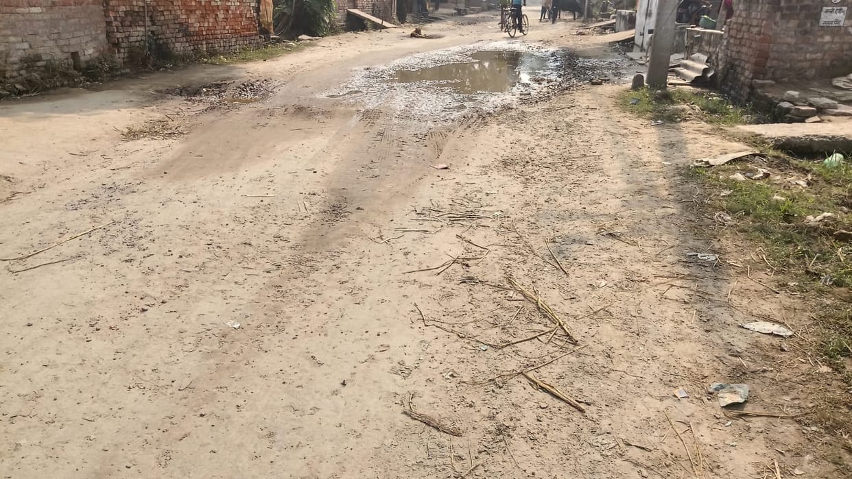 Potholes on Hirauli Road are causing problems for pedestrians.