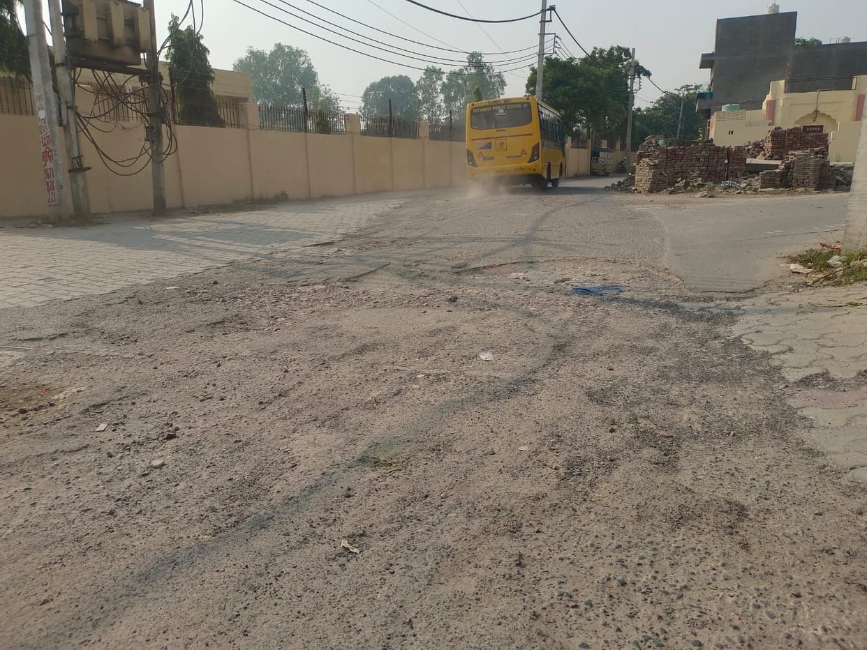 In Nehru Colony, the library is locked, roads are broken, and garbage is piled up.
